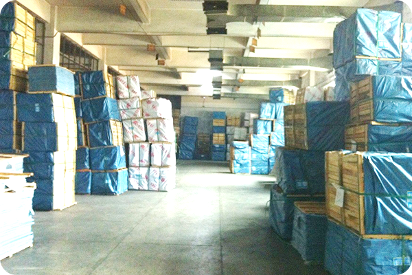 Indoor warehouse storage area with stacked paper products